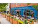 Charming outdoor dining area with umbrellas and colorful flowers, perfect for enjoying meals and drinks at 102 Newell St, Chapel Hill, NC 27516