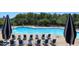 Relaxing community pool with lounge chairs and umbrellas at 102 Newell St, Chapel Hill, NC 27516