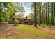 View of the backyard, with a deck, brick home and fenced-in yard at 103 Tiara Ct, Garner, NC 27529