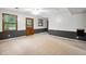 Finished basement featuring a wooden door, large windows, and two-toned paint at 103 Tiara Ct, Garner, NC 27529