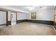 Finished basement with carpeting, fresh paint, and natural light from the window at 103 Tiara Ct, Garner, NC 27529