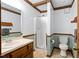 Well-lit bathroom with a walk-in shower, toilet, and vanity sink combination at 103 Tiara Ct, Garner, NC 27529