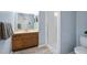 Bathroom featuring a vanity with a sink, a framed mirror, and a walk-in shower at 103 Tiara Ct, Garner, NC 27529