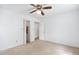 A cozy bedroom with neutral carpet, a ceiling fan, and a closet with doors at 103 Tiara Ct, Garner, NC 27529