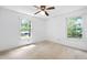 Bedroom with two sunny windows and neutral carpet at 103 Tiara Ct, Garner, NC 27529