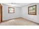 A bright bedroom with two windows and a closet, all contributing to its comfortable appeal at 103 Tiara Ct, Garner, NC 27529
