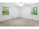 Bright bedroom with large windows offering natural light and views of the surrounding greenery at 103 Tiara Ct, Garner, NC 27529