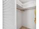 A closet with shelving, a hanging rod, and bifold doors provides ample storage space at 103 Tiara Ct, Garner, NC 27529