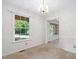 Dining room with large windows offering plenty of natural light at 103 Tiara Ct, Garner, NC 27529