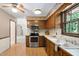 Retro kitchen with stainless steel appliances and wooden cabinetry at 103 Tiara Ct, Garner, NC 27529
