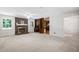 Bright living room with a brick fireplace, a ceiling fan, and carpet at 103 Tiara Ct, Garner, NC 27529