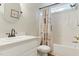 Bathroom with white vanity and shower/bathtub combo at 110 Phyllis Dr, Benson, NC 27504