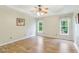 Spacious bedroom with trey ceiling, two windows, and wood-look floors at 110 Phyllis Dr, Benson, NC 27504