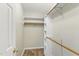Walk-in closet with wood shelving and wood-look floors at 110 Phyllis Dr, Benson, NC 27504