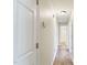 Clean hallway with hardwood floors leading to bright rooms with modern updates at 110 Phyllis Dr, Benson, NC 27504