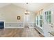 Open-concept living room featuring hardwood floors and lots of natural light at 110 Phyllis Dr, Benson, NC 27504