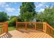 Back deck with views to lush backyard and sky at 1211 Azalea Dr, Zebulon, NC 27597
