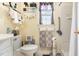Well-lit bathroom featuring updated fixtures, storage, and a shower with grab bars for accessibility at 1211 Azalea Dr, Zebulon, NC 27597