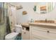 Bathroom showcasing modern vanity, shelving, and updated fixtures, combining style with practicality at 1211 Azalea Dr, Zebulon, NC 27597