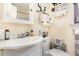 Cozy bathroom features a toilet, sink, mirror, and storage shelves to maximize space and functionality at 1211 Azalea Dr, Zebulon, NC 27597