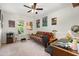 Bedroom featuring a futon, posters on the wall, and a ceiling fan at 1211 Azalea Dr, Zebulon, NC 27597
