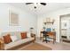 Inviting bedroom featuring a futon, desk setup, and convenient access to a bathroom, ideal for a guest room at 1211 Azalea Dr, Zebulon, NC 27597