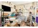 Untidy bedroom with tv, ceramics equipment and cluttered surfaces at 1211 Azalea Dr, Zebulon, NC 27597