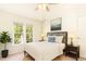 Well-lit bedroom with a modern bed, cozy lamps, and a window offering a view of the outdoors at 1211 Azalea Dr, Zebulon, NC 27597