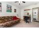 Bedroom featuring a futon, posters on the wall, and a ceiling fan at 1211 Azalea Dr, Zebulon, NC 27597