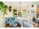 Charming dining area featuring a wooden table, tropical chair covers, and natural light at 1211 Azalea Dr, Zebulon, NC 27597