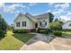 Charming single Gathering home with landscaped yard and inviting front porch at 1211 Azalea Dr, Zebulon, NC 27597