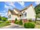 Attractive home exterior featuring well-maintained landscaping and charming architectural details at 1211 Azalea Dr, Zebulon, NC 27597