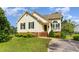 Charming one-story home with vinyl siding, green shutters and a well-manicured front yard at 1211 Azalea Dr, Zebulon, NC 27597