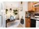 Charming kitchen with a breakfast nook featuring hanging plants and a vintage clock adding character at 1211 Azalea Dr, Zebulon, NC 27597
