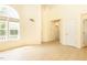 Open living space with high ceilings, large window, and neutral color palette creating a bright, inviting atmosphere at 1211 Azalea Dr, Zebulon, NC 27597