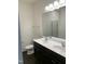 Bathroom featuring double sinks, large mirror, and vinyl flooring at 1249 Turkey Trot Rd, Wendell, NC 27591