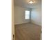 Bright bedroom with a window, neutral carpet, creating a serene atmosphere at 1249 Turkey Trot Rd, Wendell, NC 27591