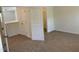 Bedroom with neutral carpet and white trim, featuring a walk-in closet for ample storage at 1249 Turkey Trot Rd, Wendell, NC 27591
