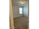 Bedroom with a window, carpet, and natural light, creating a calming atmosphere at 1249 Turkey Trot Rd, Wendell, NC 27591