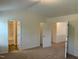 Bedroom with neutral carpet and a view of the bathroom and closet at 1249 Turkey Trot Rd, Wendell, NC 27591