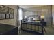 Modern bedroom with unique wall paneling, curated artwork, and stylish decor at 1249 Turkey Trot Rd, Wendell, NC 27591