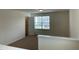 Bedroom with neutral carpet and walls, a closet, and a large window at 1249 Turkey Trot Rd, Wendell, NC 27591