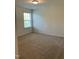 Bedroom with a window allowing natural light, neutral carpet, and a simple, calming atmosphere at 1249 Turkey Trot Rd, Wendell, NC 27591