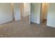 Spacious bedroom with neutral carpet, white walls, and walk in closet at 1249 Turkey Trot Rd, Wendell, NC 27591