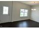 The dining room features dark wood floors, a window, and a door at 1249 Turkey Trot Rd, Wendell, NC 27591