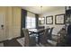 Contemporary dining area with natural light, stylish furnishings, and decorative wall art at 1249 Turkey Trot Rd, Wendell, NC 27591