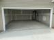 Unfinished two-car garage with concrete floor and ample space for parking and storage at 1249 Turkey Trot Rd, Wendell, NC 27591