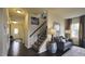 Inviting living room with hardwood floors, staircase, neutral walls, and cozy seating area at 1249 Turkey Trot Rd, Wendell, NC 27591