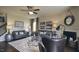 Inviting living room with neutral paint, fireplace, ceiling fan, stylish decor, and coordinated furnishings at 1249 Turkey Trot Rd, Wendell, NC 27591