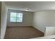Room with neutral carpet and a large window at 1249 Turkey Trot Rd, Wendell, NC 27591